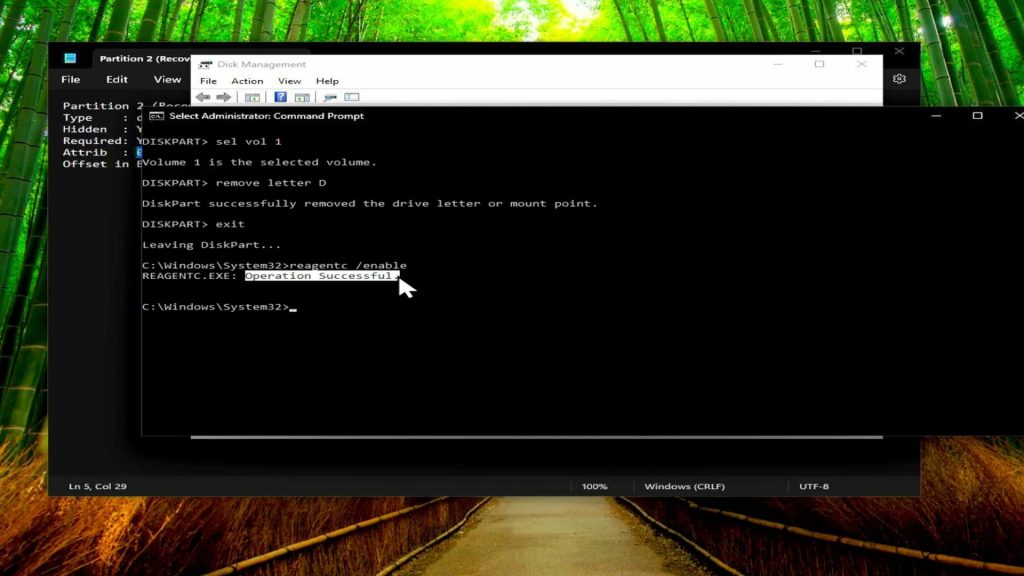 Command prompt displaying successful reagentc enable command restoring Windows recovery environment